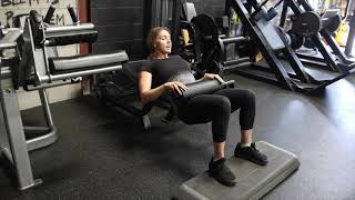 Hip Thrust on Lying Hamstring Curl Machine How To [upl. by Anilosi]