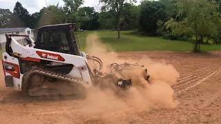 Tilling a yard with Bobcat T66 and Harley rake [upl. by Monafo]