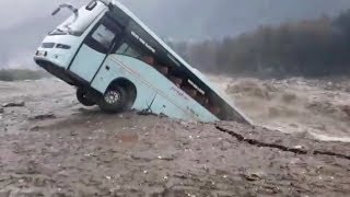 Bus swept away by floods in northern India [upl. by Dollar]