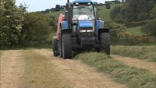 New Holland TM150 with Kuhn baler [upl. by Sidnala]