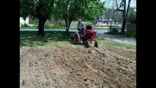 1948 Farmall Cub Plowing Garden Spring 2012 [upl. by Wallache394]