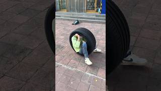 This boy is inside this small tyre and is spinning it round and round [upl. by Sisxela]