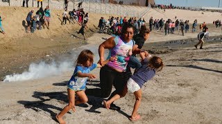 Hundreds of migrants try to storm US border [upl. by Duff155]