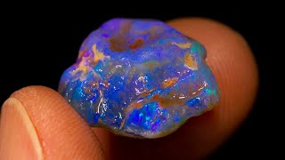 Blue uncut gem rough opal with fire inside  I take its top off [upl. by Aninnaig959]