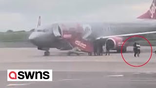 Moment armed police remove man from Jet2 flight after bomb scare  SWNS [upl. by Kurland]