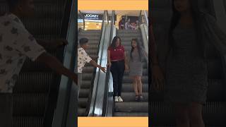 Touching Hands On Escalator Prank shorts funny escalator comedy prank [upl. by Jarlen]