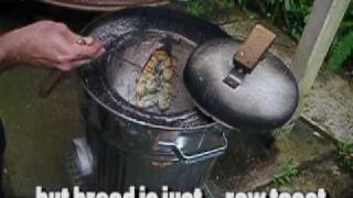 cooking naan bread in a homemade trash can wood fired tandoor oven  tandoori [upl. by Oiluj]