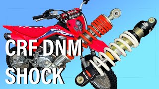 CRF110 SUSPENSION UPGRADE HOW TO INSTALL DNM SHOCK [upl. by Aronael408]