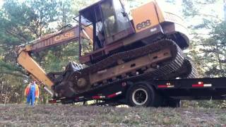 Unloading A Case 688 Excavator [upl. by Ahseyi]