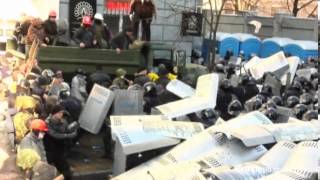 Ukrainian antigovernment protesters clash with police [upl. by Ardnosac858]