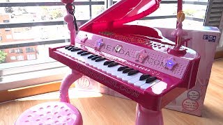 PIANO DE COLA CON SILLA ORGANETA DE JUGUETE ROSADO MODO APRENDIZAJE LEDS EN CADA TECLA [upl. by Carder]