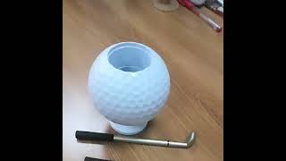 This creative golf ballshaped pen holder is small and unique adding color to your desktop [upl. by Anirbed]