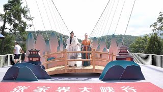 Celebrations held for Qixi Festival on glass bridge in Chinas Zhangjiajie [upl. by Kohl517]