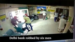 Delhi bank robbed by six men cashier shot dead [upl. by Eesdnyl7]