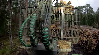 John Deere 1010G unloading spruce pulpwood [upl. by Terrene]