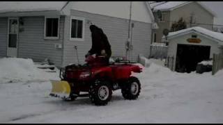 plowing driveway with 2009 550h1 arctic cat atv [upl. by Aicileb3]