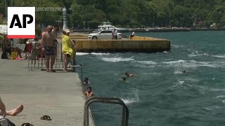 Turks cool off during unseasonable heat on banks of Bosporus [upl. by Channing]