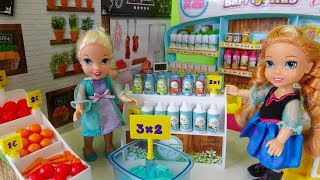 Elsa and Anna toddlers go shopping at the supermarket and buy toys [upl. by Kerstin]