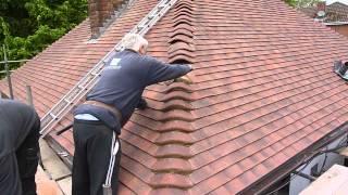 Reroofing my your house Cementing the bonnet tiles wwwgarecoukroof [upl. by Pilar]