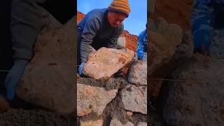 The process of building a cement stone wall without tools craftsman shorts [upl. by Issak]