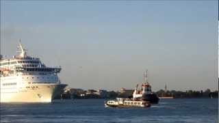 Tugboats guiding huge cruise ship into Venice port Ship towers over Venezia [upl. by Johan480]