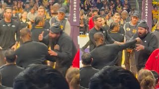 LeBron James pushes away fan for running up to him on Lakers bench 😳 [upl. by Haimaj870]