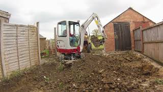 Digging out a rear garden and loading dumpers with a mini digger excavator Takeuchi TB216 Thwaites [upl. by Aiki120]