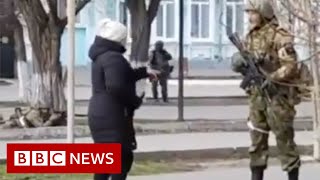 Ukrainian woman confronts armed Russian soldier  BBC News [upl. by Adela]