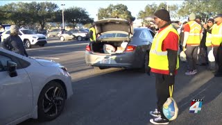 Thousands wait for hours to get Thanksgiving supplies in Downtown Jacksonville [upl. by Ludwog806]