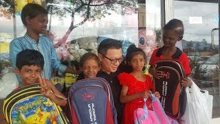 Melaka businessman buys school gear for siblings with deformities [upl. by Ettelrats]