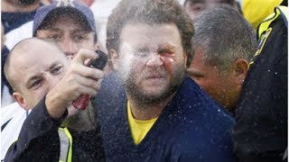 Police Officer Sprays Handcuffed Football Fan With Pepper Spray From Inches Away [upl. by Eleumas]