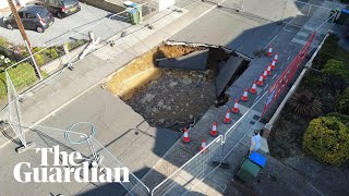 Residents peer into huge sinkhole in southeast London [upl. by Ashok139]