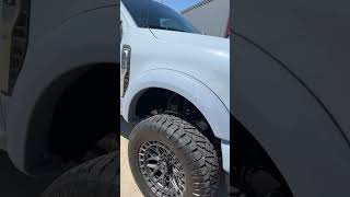 Lifted 2024 Ford F250 Platinum gets painted to match Bushwhacker Pocket Flares [upl. by Ived383]