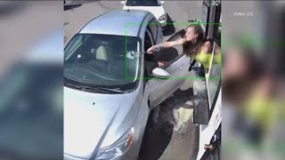 Seattle bikini barista shatters windshield with hammer after customer throws drinks at her [upl. by Llenyar]