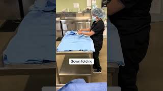 In school surgical technology students practice folding gowns shorts [upl. by Mihalco78]