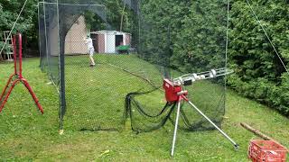 Batting Cage Clip with Heater Pitching Machine [upl. by Carnahan294]