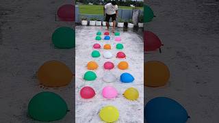 The balloon man jumps onto water balloons randomlyfunny race trending balloon challenge sports [upl. by Omar81]