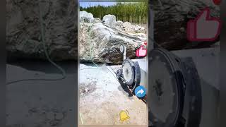 The process of sawing boulders with a rope saw [upl. by Lucilla]