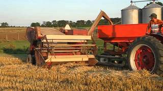 IH 560 with IH 80 PullType Combine Harvesting Wheat Unloading [upl. by Lattimer]