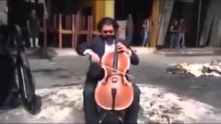 Iraqi cellist Karim Wasfi plays music on bomb explosion site [upl. by Swenson671]