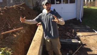 Pulling a retaining wall straight with wall anchors [upl. by Burnley]