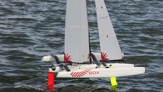 Foiling  radio controlled One Metre trimarans with Z and kinked foils [upl. by Rennane]