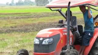 M6040 Kubota tractor on vietnamese farmer field [upl. by Ardnas]