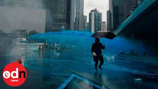 Police in Hong Kong Spray Blue Water on Protesters to Identify Them Later [upl. by Hannah603]