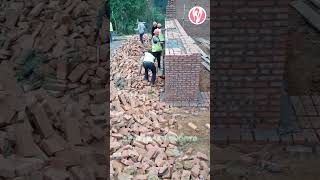 Bricklayers are building a red brick wall [upl. by Ramled]