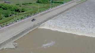 Aerial footage captures spectacular tidal bore on Qiantang River [upl. by Rehpotsrihc]