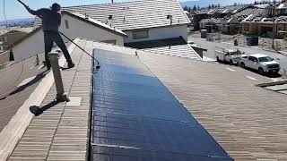 How to Clean Solar Panels With A Waterfed Brush the Easy Way [upl. by Remat]