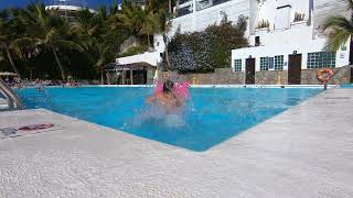 Jumps on pink air mattress in Hotel Altamar pool Puerto Rico Gran Canaria [upl. by Joyce]