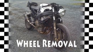 Part 1 Motorcycle Front Wheel Removal CBR600  Tire DIY How To [upl. by Aipotu]