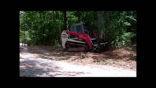 Gyrotrac low flow 400HL mulching head  Takeuchi TL12 23 GPM [upl. by Ahsiniuq]